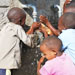 Children drink from a new well